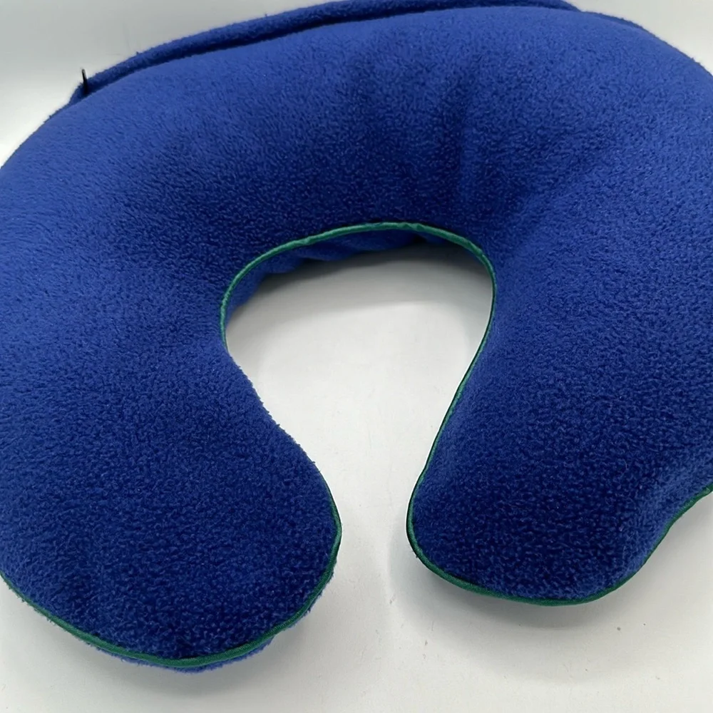 Austin House blue neck travel pillow with green piping
